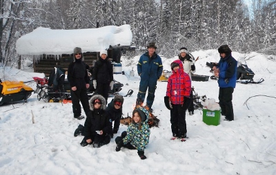 A family holiday trapping on snowmobiles